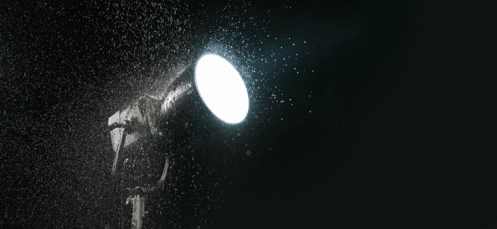 a Nanlux Evoke 2400B Bi-Color LED light shining through the rain