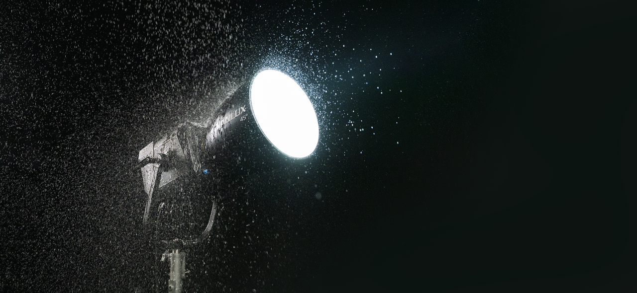 a Nanlux Evoke 2400B Bi-Color LED light shining through the rain